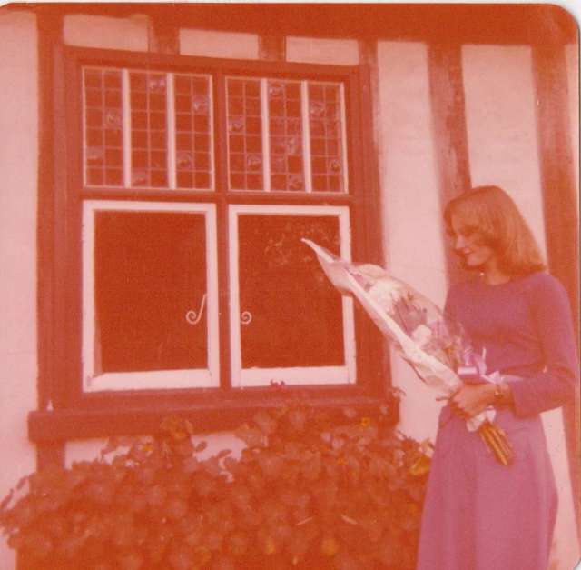 Me outside our home in Suffolk, summer of 1976. with a bouquet of flowers given me by my mum after receiving my O Level results.  This was before I knew what I was in for with my first job.  It made me wonder why I bothered working so hard. Forget A Levels, I wanted to earn money.  Ironic that I ended up taking a full-time college course anyway! (c) Sherri Matthews 