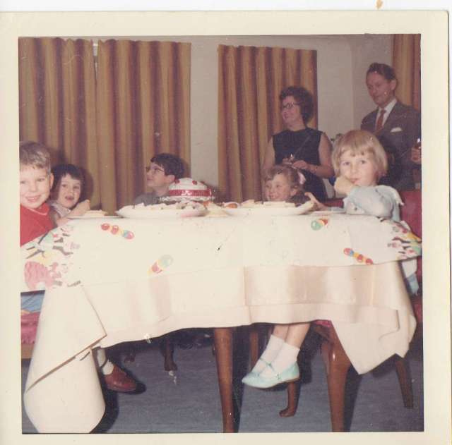 Me, with my brother and cousins (and uncle and auntie in the background) enjoying the party in my party dress and sparkly shoes.  And yes, I do have chocolate on my face!   Mid 1960's (c) Sherri Matthews 2014